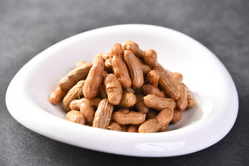 nuts in a bowl on white background