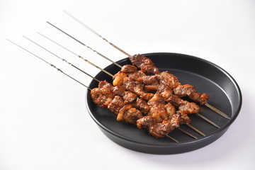 meat on plate isolated on white