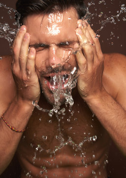 Close Up Young Manful Guy Washing Face