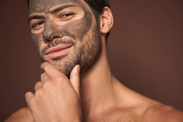 Sexy self-important manful guy with face mask