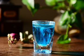 glass of water on wooden table