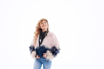 Fashion Model girl portrait isolated on white background. Beauty stylish brunette woman posing in fashionable clothes, fur coat, sunglasses, denim in studio. Casual style. High fashion urban style