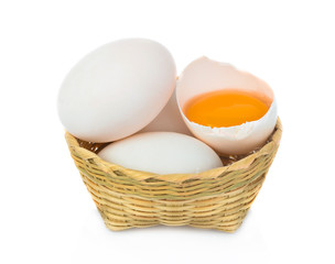 Duck egg in bomboo basket isolated on white background.