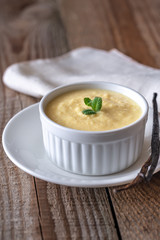Custard on the wooden background
