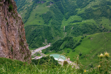 A caucasian mountain landscape. A valley and a green pasture. The Georgia, Caucasus.