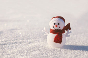 Snowman on snowy shining background. Christmas and New Year card.