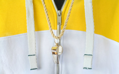 whistle of a soccer or football referee or trainer on a sweat suit, free copy space