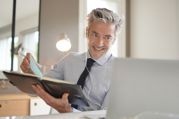 Businessman on video call in contemporary office