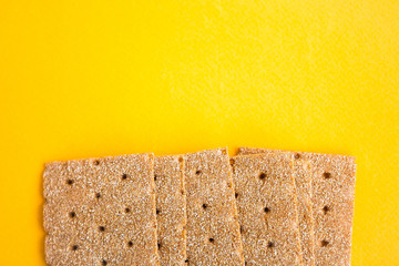 Crisp bread on the yellow background