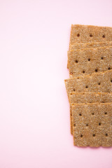 Crisp bread on the pink background
