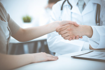 Obraz na płótnie Canvas Partnership, trust og doctor and patient, medical ethics concept. Handshake in medicine