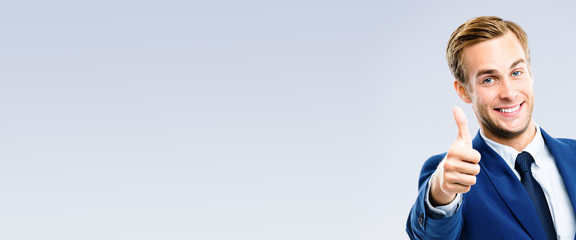 businessman with thumbs up gesture