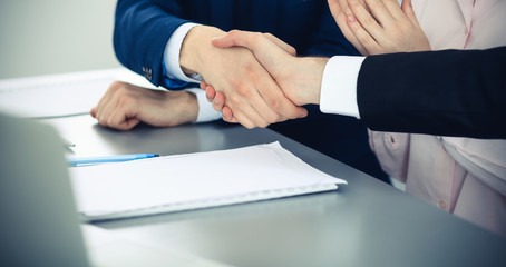Obraz premium Business people shaking hands finishing up a meeting. Handshake at successful negotiation