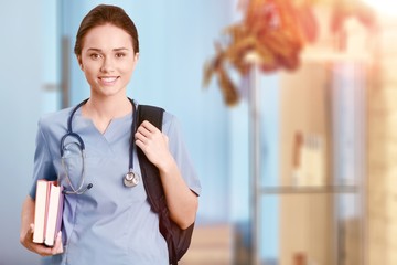 Nurse student with books and stethoscope