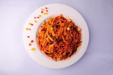pasta with tomato sauce and fresh basil on white plate