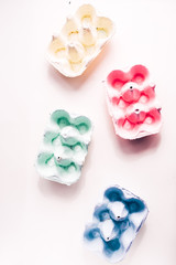 Colored eggs container, easter concept, soft natural direct light