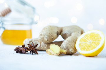 ginger root, lemon, honey, anise on a white background