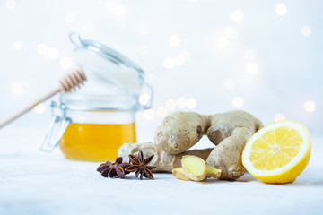 ginger root, lemon, honey, anise on a white background