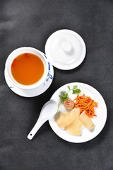 cup of tea with lemon on white plate