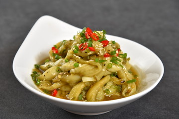 pasta with pesto sauce and basil
