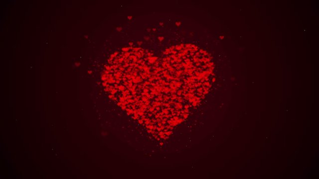 Red heart is isolated on burgundy background. Accumulation of little hearts creates one large heart. The whole heart is being zoomed. Close up. Copy space.