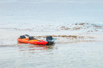 Kayaks stranded on the bancks of corals at the low tide. Caribessa, Bessa beach at Joao Pessoa PB, Brazil.