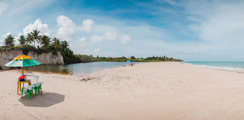 Fototapeta na wymiar Panoramic view of a lagoon called Maceio in front of the sea separated by a sand bank at Tabatinga beach, Praia de Tabatinga 2, Costa do Conde. Brazilian northeast beach.