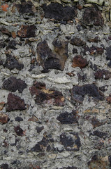 Old wall made of heavy rocks and concrete. Wall texture.