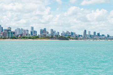 Obraz premium View of Praia de Tambau beach and the city on background at Joao Pessoa PB Brazil. Touristic beach of Brazilian northeast. View from the sea to the city.