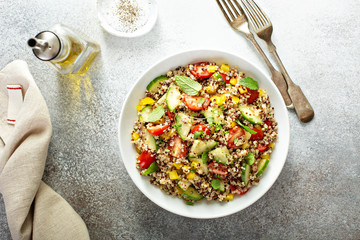 Fresh quinoa tabbouleh salad with tomatoes and cucumbers