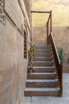 Old stone stair case with wooden balustrade leading to historic Beit Zeinab Khatoun building (Zeinab Khatoun House), Old Cairo, Egypt