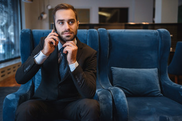 Handsome young businessman wearing suit