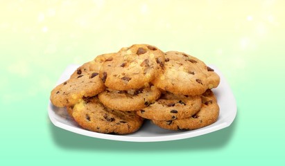 Plate of chocolate chip cookies isolated on white background