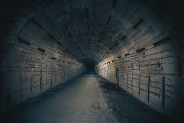 Dark creepy underground tunnel or corridor on abandoned Soviet military bunker