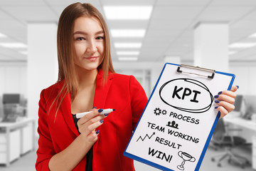 Business, technology, internet and networking concept. Young entrepreneur showing keyword: KPI