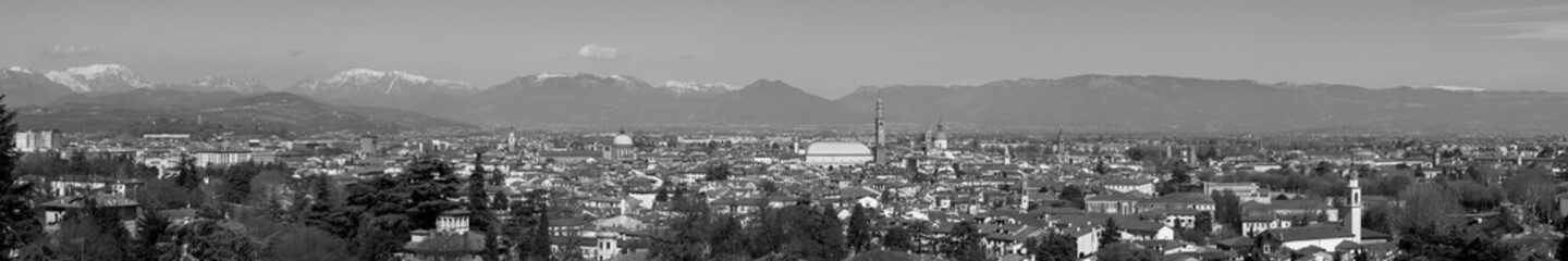 wide panorama of the city of Vicenza and the famous monument called Basilica Palladiana with the tall Clock Tower. Vicenza, Veneto, Italy - April 2019