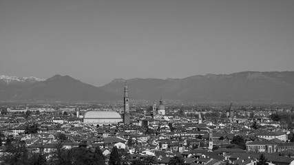 wide panorama of the city of Vicenza and the famous monument called Basilica Palladiana with the tall Clock Tower. Vicenza, Veneto, Italy - April 2019
