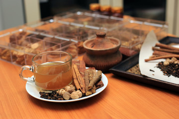 Brewed healthy herbal tea on a wooden background with all dry herbs ingredients. Herbal teas beverage for chinese or thai traditional alternative medicine therapy. 