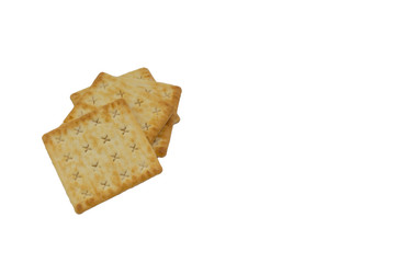 Cracker biscuits over white background. Selective focus