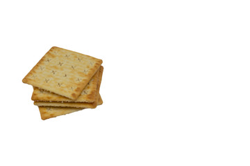 Cracker biscuits over white background. Selective focus