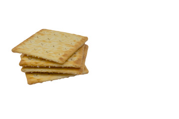 Cracker biscuits over white background. Selective focus