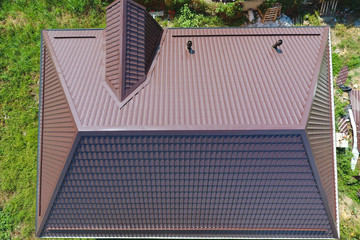 A view from above on the roof of the house. The roof of corrugated sheet. Roofing of metal profile...