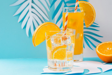 Orange juice in glass and fresh fruits