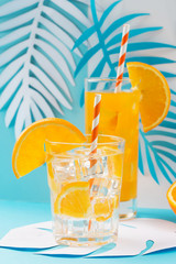 Orange juice in glass and fresh fruits
