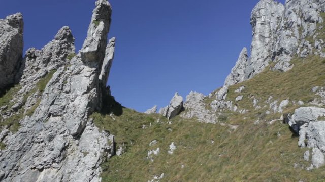 Panoramic view of the towers and spiers of the southern Grigna from the direct route, on a sunny autumn day.