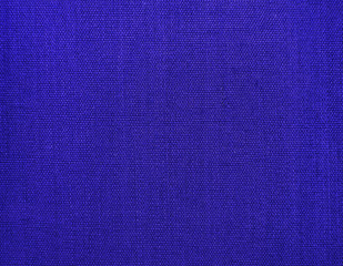 Textured background of blue natural textile    