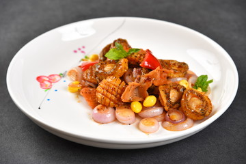 chicken with rice and vegetables on white plate