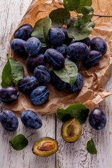 Fresh plums with leaves