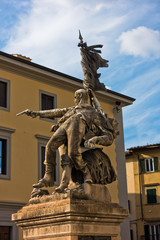Fototapeta na wymiar Historic monument at small square in downtown of Florence, Tuscany, Italy