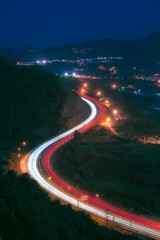 Car light trails in highway at night